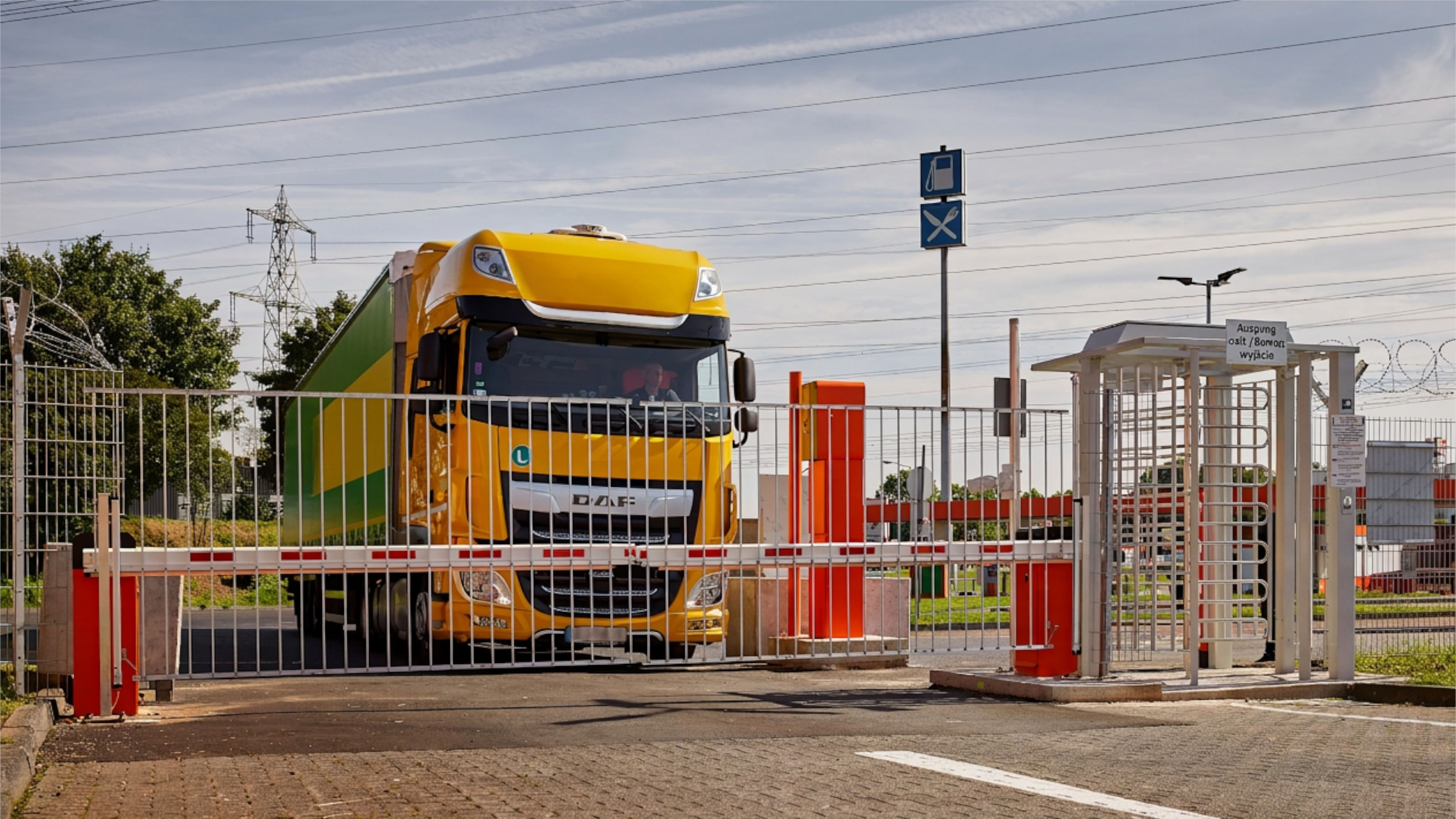 Truck at closed barrier entrance