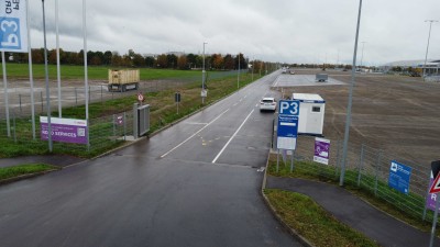 View of the entrance area of the Bosch Road Services parking lot at the Messe Karlsruhe grounds.